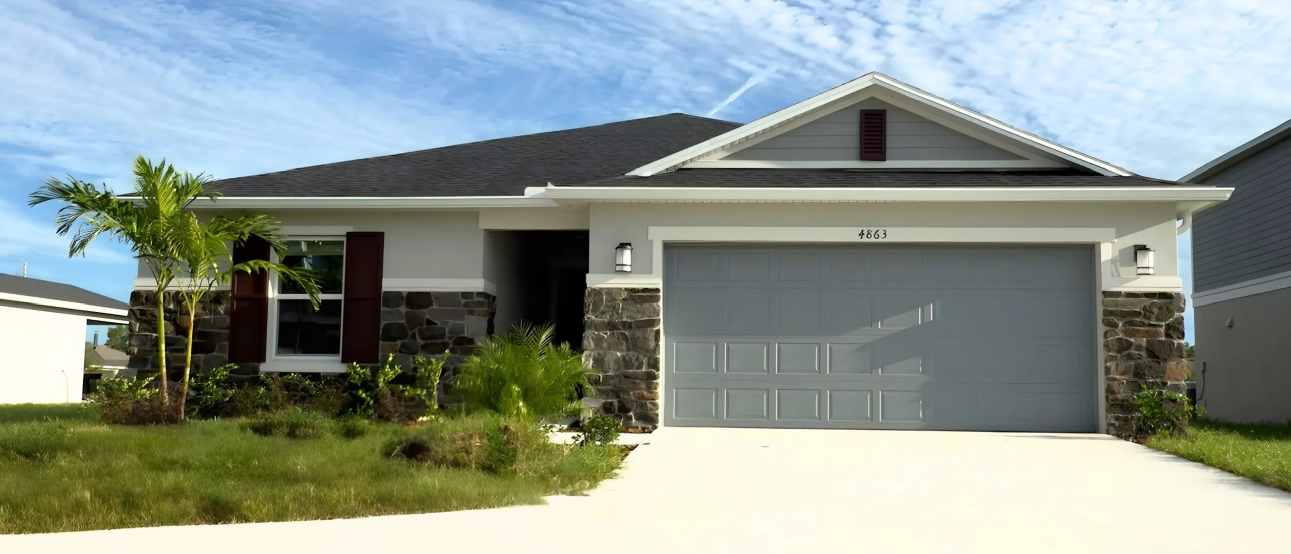 Same Florida home after exterior painting by Glades Pro