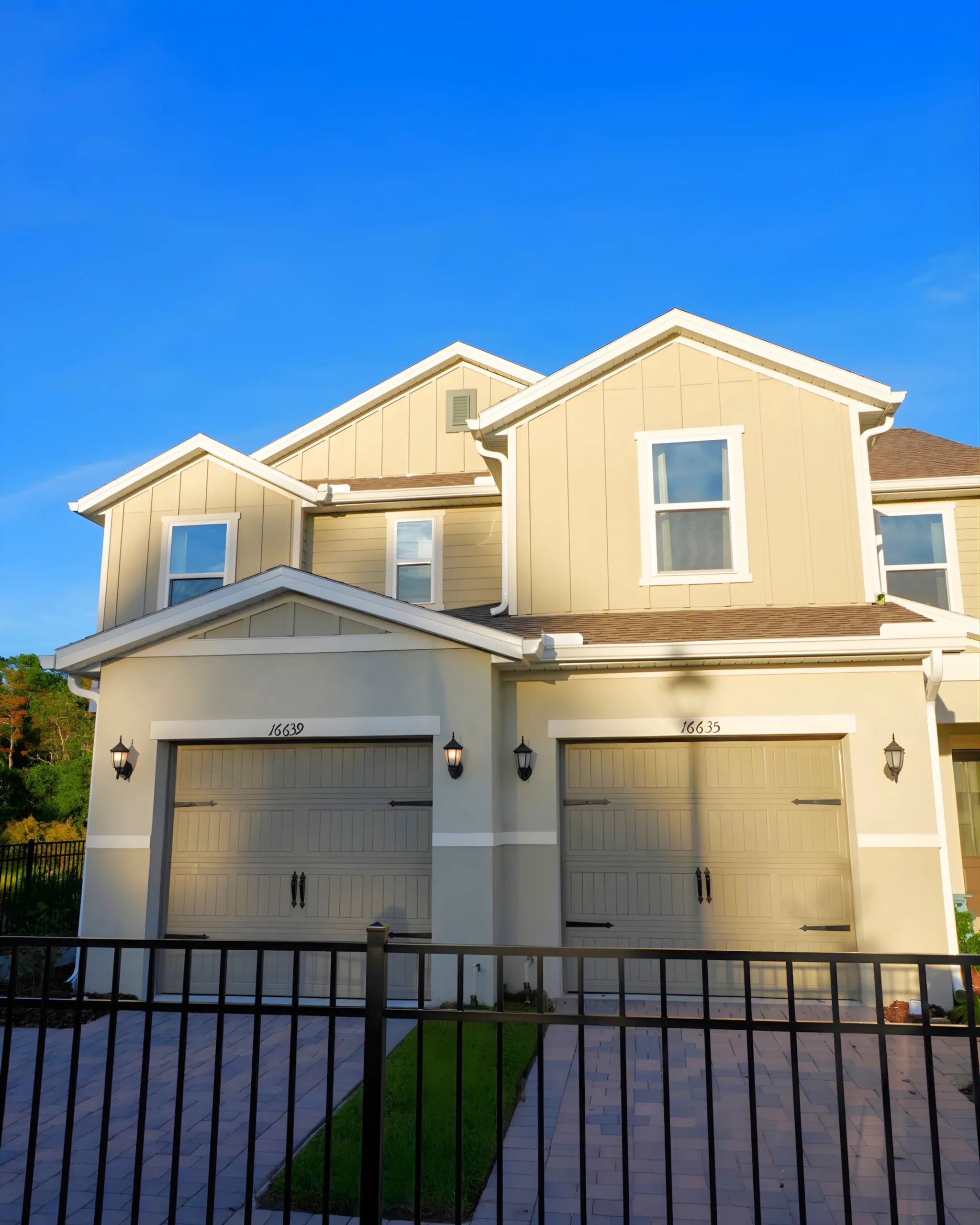 Beige two story Florida home after exterior painting